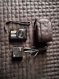 Sony Cyber-Shot DSC-WX-100 Digital Camera with case and charger