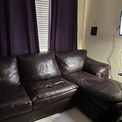 Burgundy Leather Couch with full size pull out bed
