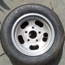 NEW MAG RIM 14 INCH WITH A NEW  TIRE