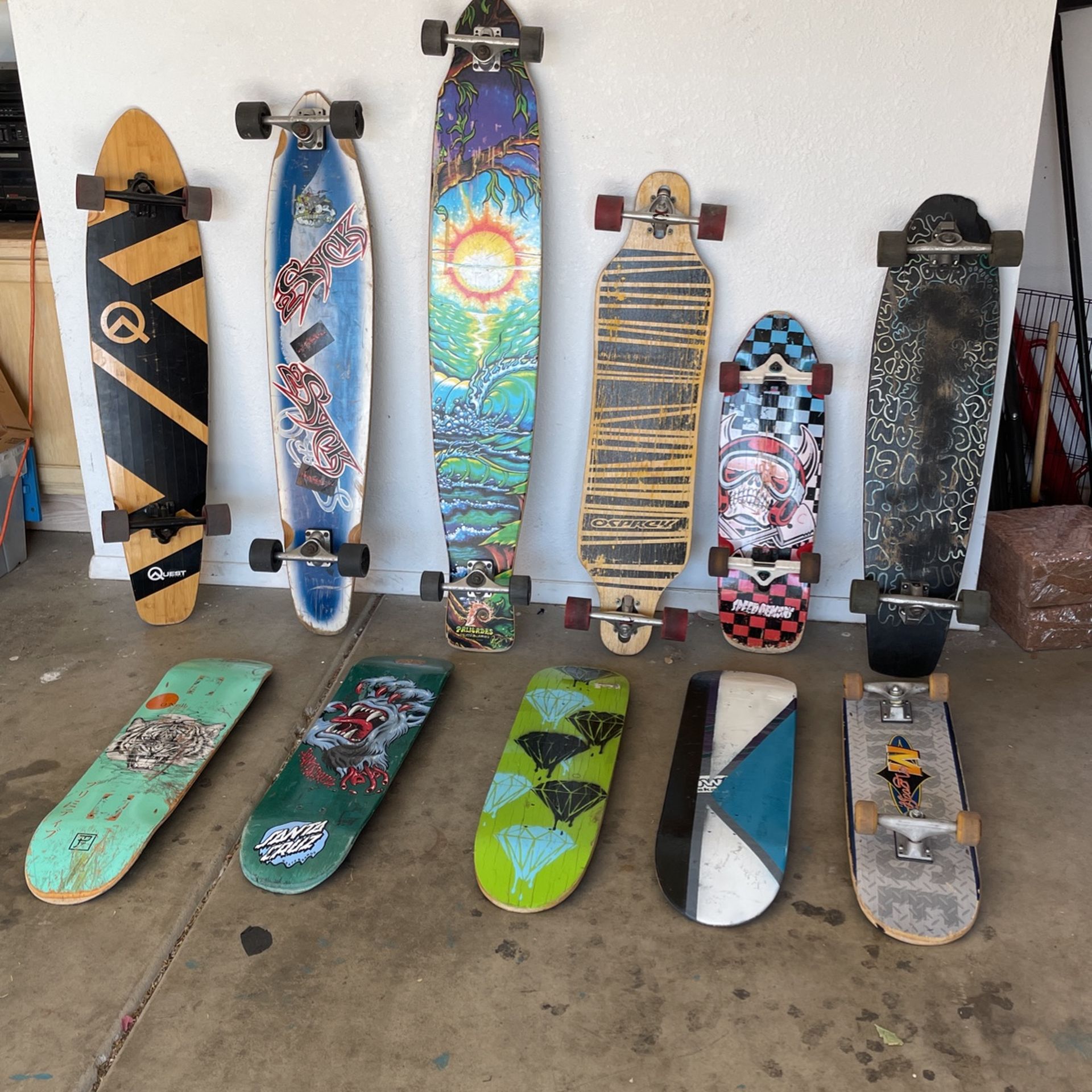 Assorted Longboards And Skateboards