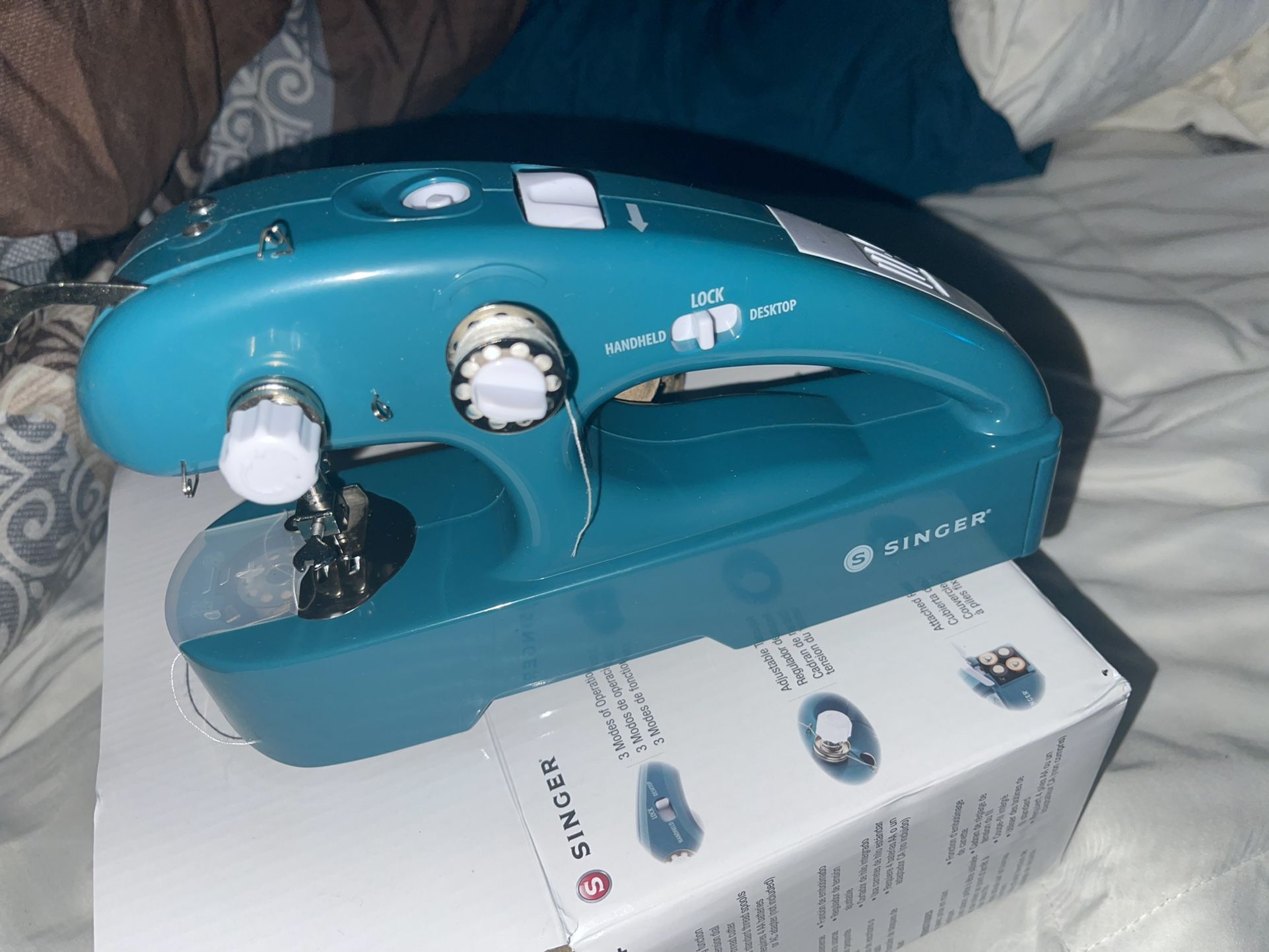Handheld sewing machine