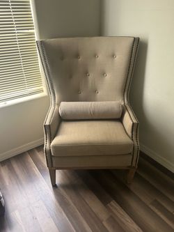 high-back upholstered wingback accent chair