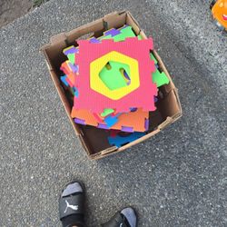 Toy floor mats for kids to play with with shapes, colors, animals and numbers.