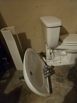 Half bathroom sink and toilet