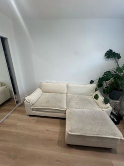 All white couch with ottoman