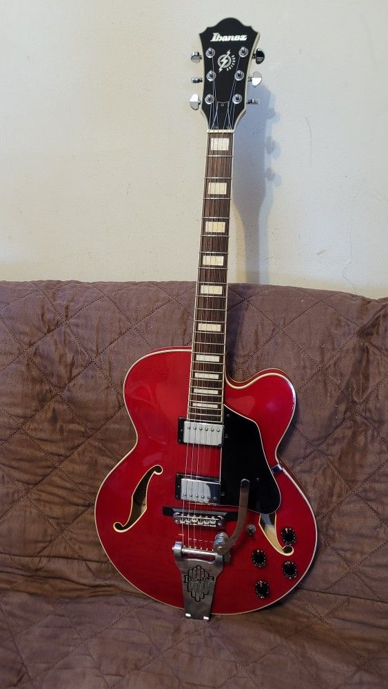 IBANEZ AFS75T-TRD-12-01 ARTCORE HOLLOWBODY ELECTRIC GUITAR WITH BIGSBY BRIDGE IN RED COLOR. 