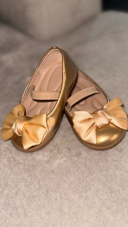 Girls' shoes (size for a one-year-old), three pairs of socks, and a dress—all for $30.