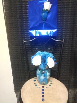 $35 NavyBlue, White roses in a glass with rhinestones on vase (matching) Navy Blue boutonniere & small crystal glass with blue & clear stones.