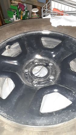 5 stock jeep rims/ tires