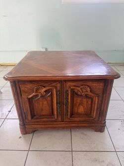 Spanish style square end table with built-in cabinet storage.