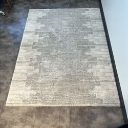 Cream color area rug - 60" x 84" - $20 OBO