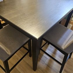 Tall kitchen table with four chairs
