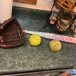 Girl’s Softball equipment including like new rawlings 12" fast pitch softball glove,  Spark Rip-It softball bat 29” 17 ounces -12 like new condition  