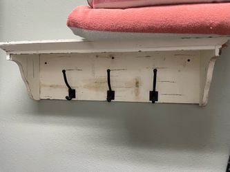 Wall shelf with hooks