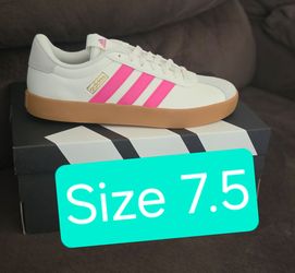 Adidas with pink stripes