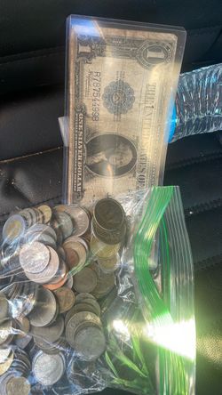 Old coins and 1923 dollar bill
