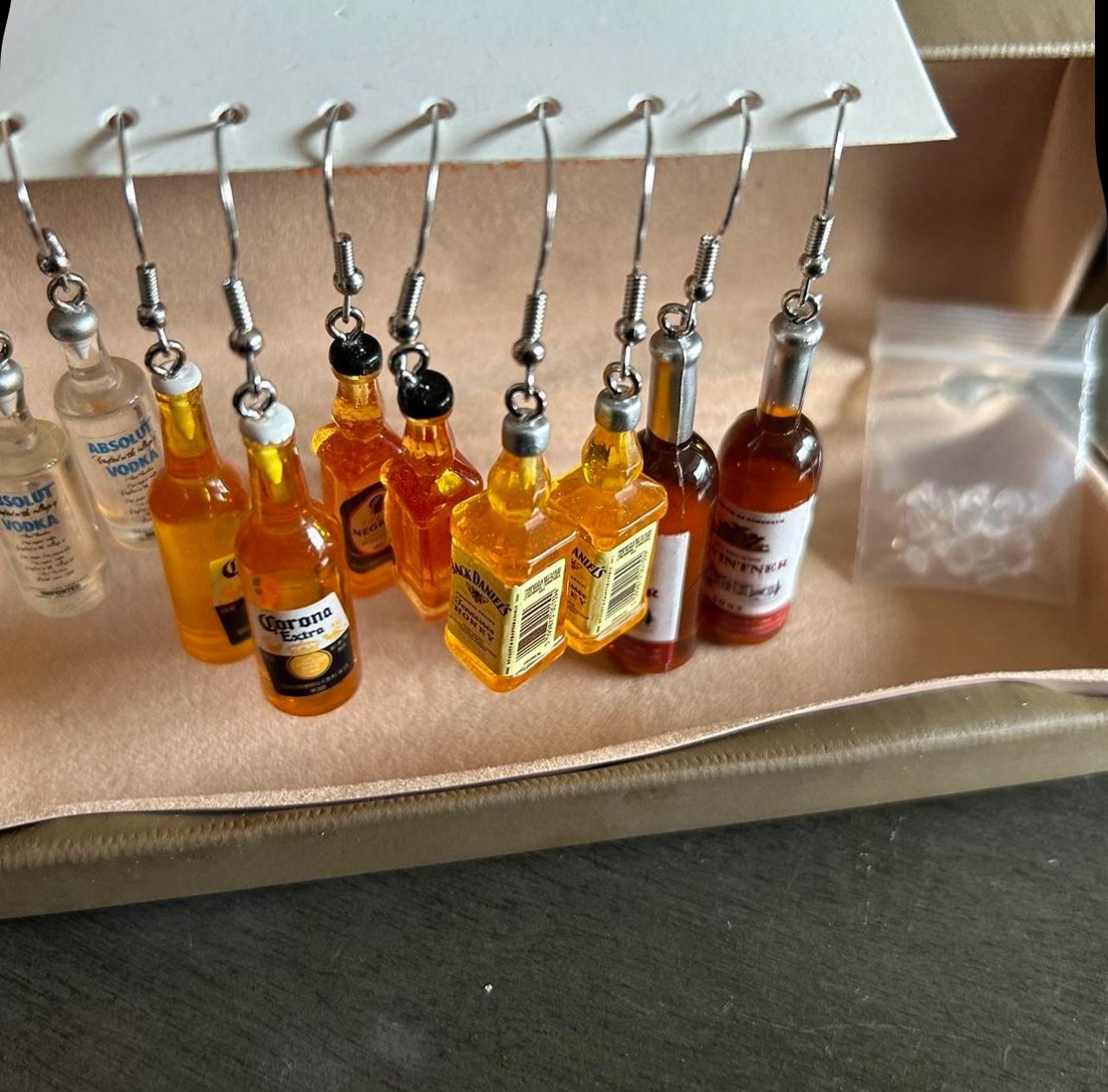 Bundle of earrings, new, mini bottles