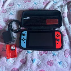 Nintendo Switch with case, game, and charger
