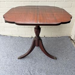 Vintage Duncan Phyfe-style mahogany flip-top game table with brass claw feet