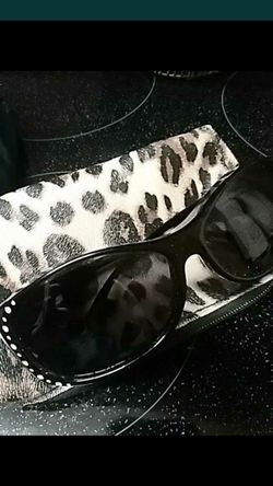 WOMENS SOLAR SHIELD SUNGLASSES WITH LEOPARD CASE.