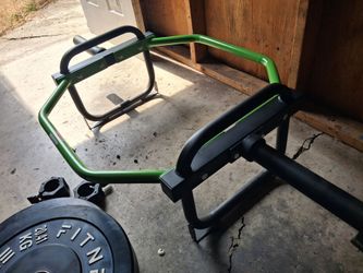 Cap Olympic trap bar and two 45 lb bumper plates