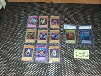 2 Yu-Gi-Oh god cards graded Beckett.. and also a sleeve of Random Yu-Gi-Oh cards.. selling as a bundle. All sales final.