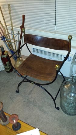 Very early solid wrought iron frame original beautiful leather Game of Throne style chair