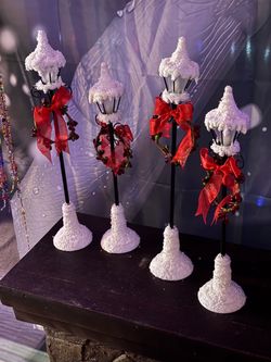 Snow covered street lamps