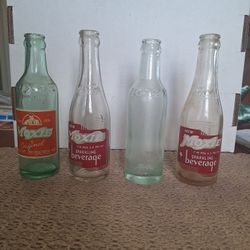 SET OF 4 VINTAGE MOXIE SODA BOTTLES