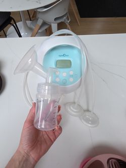 Spectra brest pump with lots of  parts+ Complimentary book