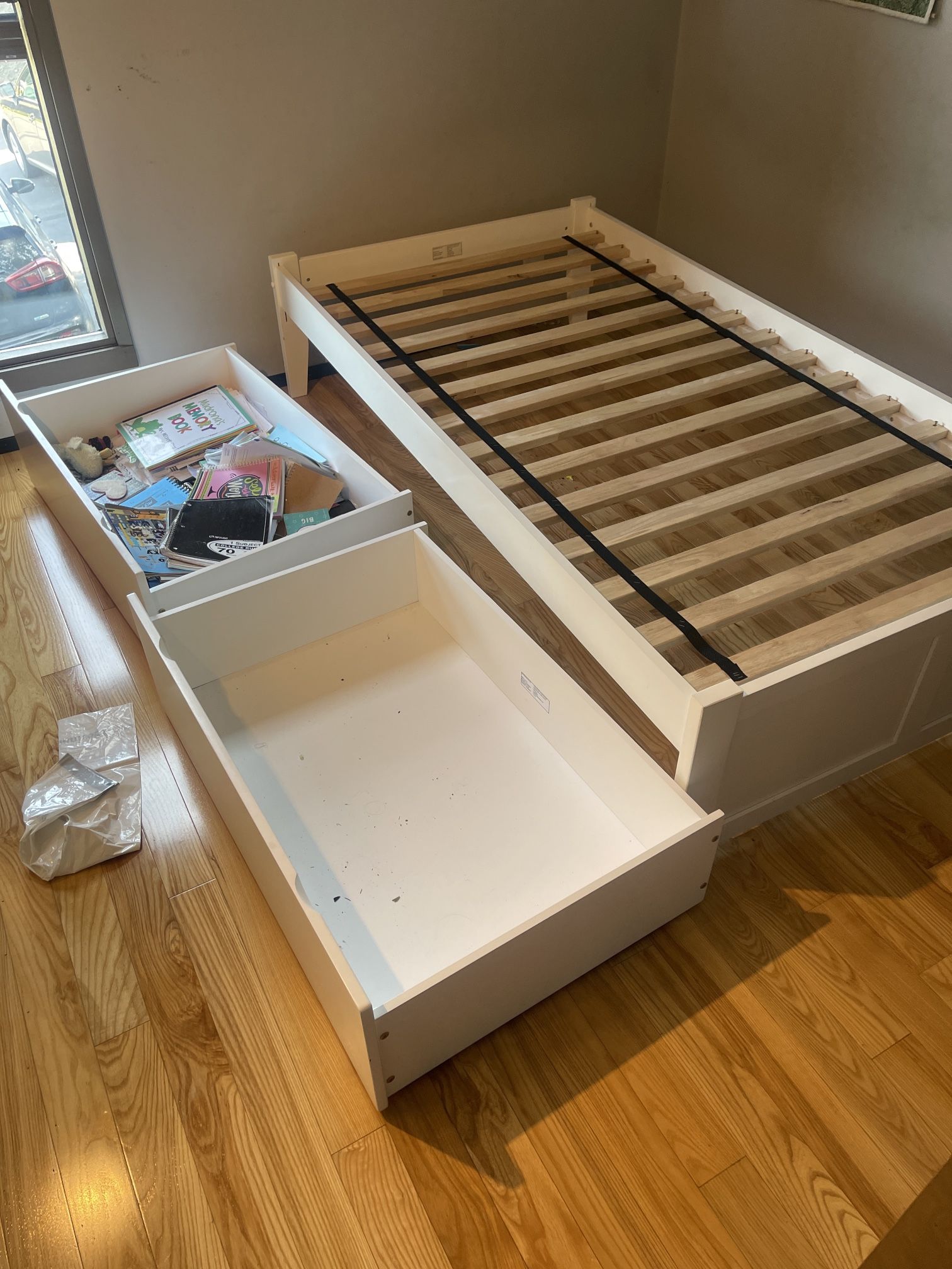 White twin bed with Rolling Storage