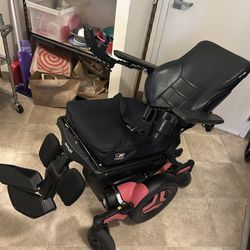 Pink and black Permobil M3 Power chair 