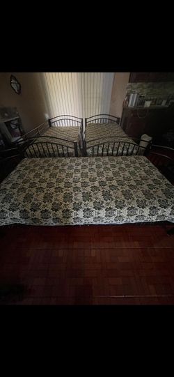 3 mattresses & 3 black bed frames