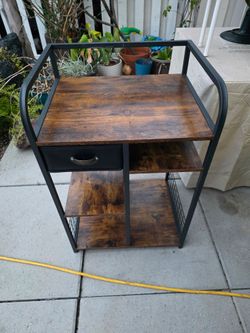 Side table with basket and drawer