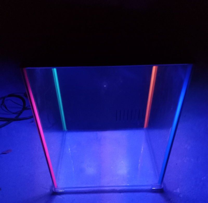 8 gallon fish tank with 7 color changing led lights and filter system also comes with supplies/food.