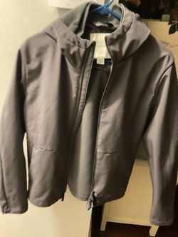 A Beautiful , Size Large, Calvin Klein, Grey Jacket, In Good Condition, But One Side Of The Bottom By The Zipper Has A Little Burn(NO SHIPPING)