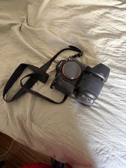 Sony Alpha Mirrorless Camera with Lens and Strap
