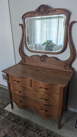 Vintage antique carved wood dresser with vanity mirror
