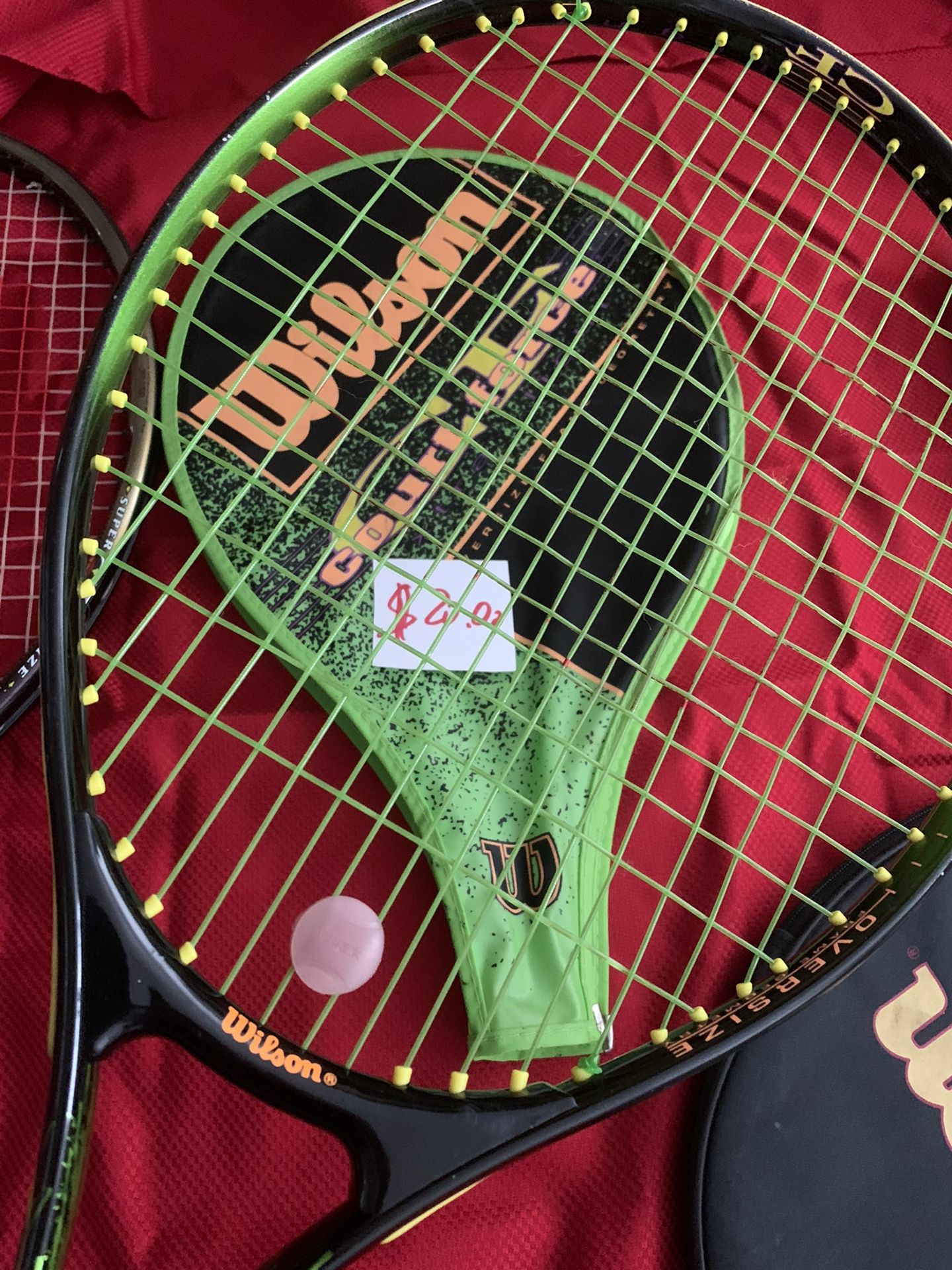 Wilson tennis racket with 10 tennis balls