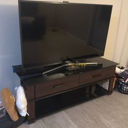 55” TV AND AN ENTERTAINMENT CENTER