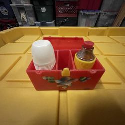 vintage plastic picnic set, specifically recognized as a "Starke Design" lunchbox shaker set from the 1950s-1960s.  It features a red plastic containe
