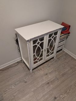 White Cabinet with glass doors on the front