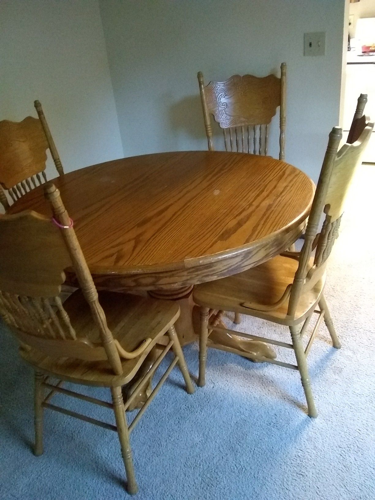 Oak dining room table with six chairs asking $125 or best offer