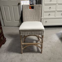 Beautiful tall, white, wicker chair in excellent condition.