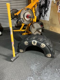 CrossFit. Tire strike with 10lb sledgehammer