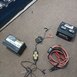 2 CAR BATTERIES, 1 SET OF JUMPER CABLES  (WITH VOLTAGE READER) & 1 CAR BATTERY CHARGER 