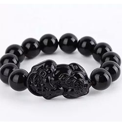 Obsidian Feng Shui wealth symbol stretch bracelet fits up to size 7.5