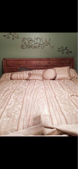King size sled bed with bed spread