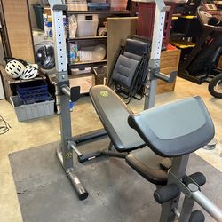 Golds Gym bench with leg extension and squat rack