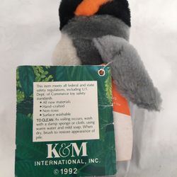 Collectible, plush penguin beanbag doll.